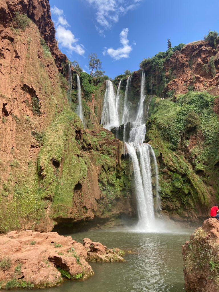 Tours Breathtaking view of the Ouzoud Waterfalls cascading into the pool in Morocco's Atlas Mountains.